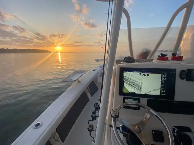 Sunset over calm Lowcountry water beside the Pathfinder